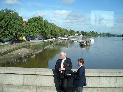 MI6 Agents conferring in front of the Thames.