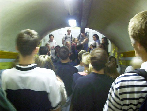 The group heads down the stairs towards the platform.  The ceiling overhead makes it obvious why this place is called 'The Tube.' (Photo Courtesy of Julianna Parker)