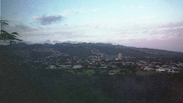 A Picture of the reflection of the sunset on the houses, as seen from Diamond Head