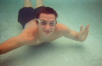 Daniel swimming in the pool.  This shot was taking when we went to the Sandpiper resorts or something like that.  We went to that place because supposedly it had a better beach.  I liked our less-crowded beach better.  (Photo Courtesy of Bryon Farris)