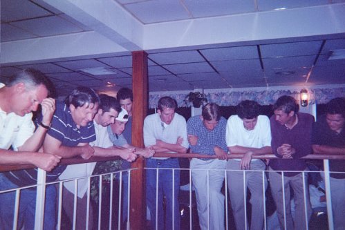 The guys looking over the balcony at the band.