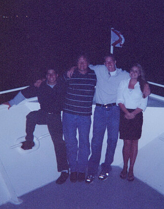 Daniel, Mr. Flora, Tyler, and Jennifer on the prow of the ship